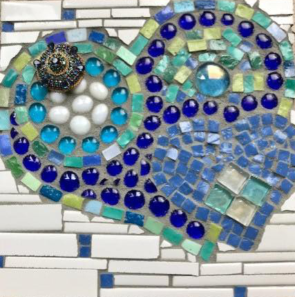 Heart mosaic, art by village resident